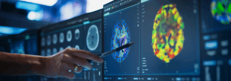 hand points to computer screen with imagery of brain scans